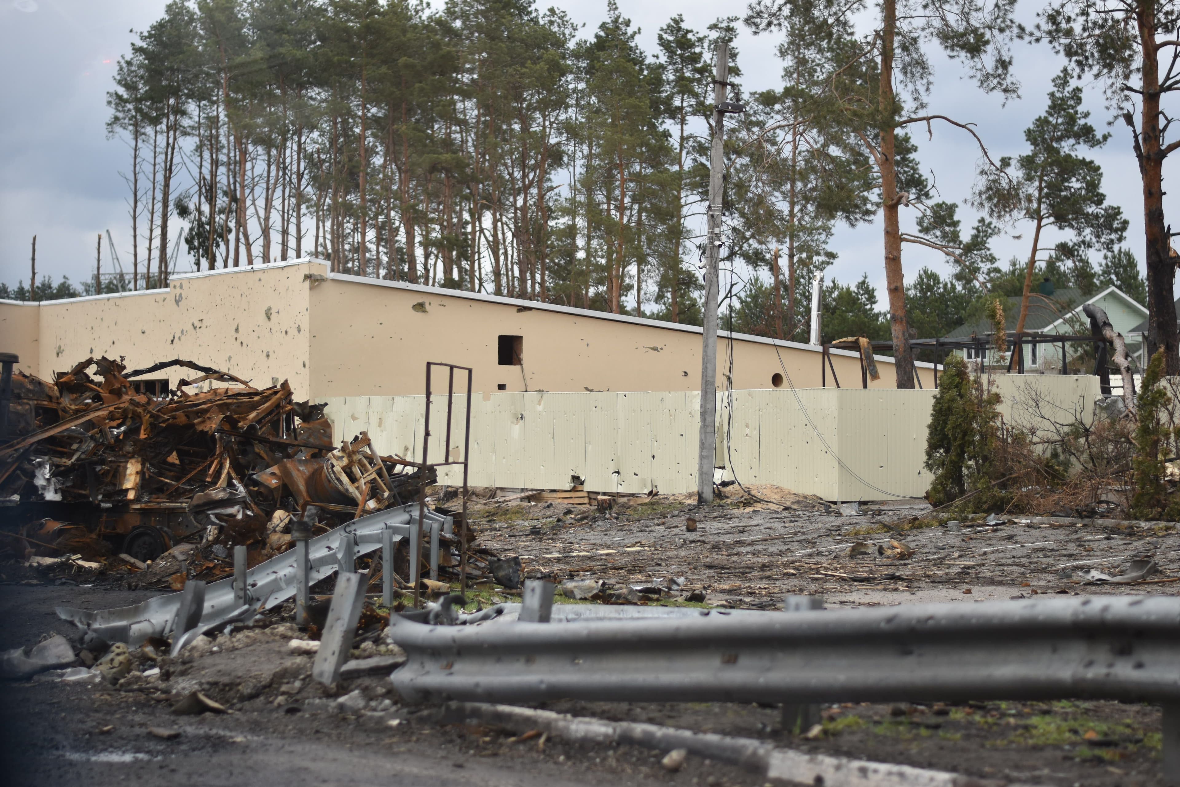 Commercial property exterior with visible storm damage.